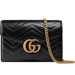 Gucci purse with gold chain.